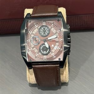 Fossil Men’s watch. Black rectangular face with leather band.